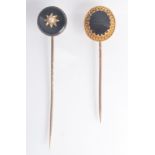 A Victorian gold cannetille pin set with black onyx,