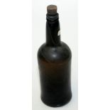 A Georgian wine bottle and contents labelled "Recovered from Wreck of HMS Caroline Sept 1971,