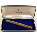 An 18ct. gold engine turned Parker 61 fountain pen, original box.