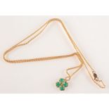 A 9ct. gold chain with green stone clover leaf pendant.