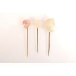 Two mother of pearl pins,