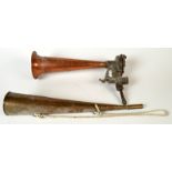 A brass foghorn and a steam foghorn.