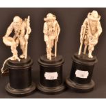 Three late 19th century Dieppe ivory carvings of beggars , height 8cm. Each on an ebonised pedestal.