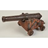 A Victorian model of a cannon.