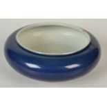 A Chinese porcelain monochrome censer, applied with a dark blue glaze, diameter 16cm.