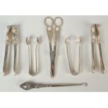 A pair of Victorian grape scissors and two pairs of matching nut crackers,