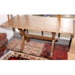 An oak Arts and Crafts rectangular refectory table on X legs, 74.5 x 152.5cm.