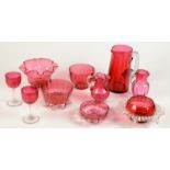 Ten pieces of cranberry glass.