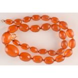 A faceted 'amber' bead necklace.