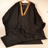 A 1930's Middle Eastern mans heavy black open robe with a gold thread collar.