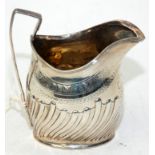 A George III helmet milk jug by Peter and Anne Batemen, London 1797, the body engraved and fluted,