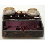 A pair of Victorian open fluted silver salts and matching spoons, cased.