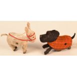 A clockwork Schuco black Scottie dog toy and a clockwork donkey.