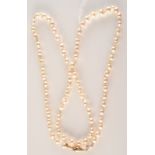 A Baroque pearl necklace with 18ct. gold clasp.