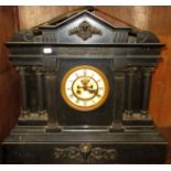 A large black marble cased architectural mantel clock, with revealed escapement.