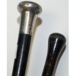 A silver mounted ebony walking cane by Howell, together with one other walking cane.