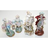 A pair of continental biscuit figures of a boy and girl each carries two baskets,