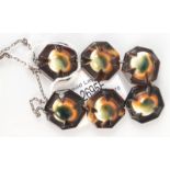 A tortoiseshell and operculum shell necklace.