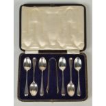 A set of six Hanoverian pattern tea spoons and matching tongs, cased.