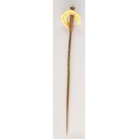 A gold Victorian presentation jockey's stick pin in the form of a whip, about the handle,