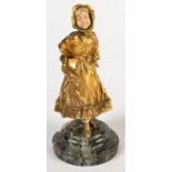 A continental gilt bronze and ivory figure of a girl wearing a bonnet, marble base, height 19cm.