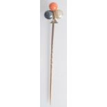 A good late Victorian gold pin, the finial of clover form, set with a black pearl,