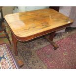 A Regency rosewood veneered rectangular centre table with bobbin turned frieze on twin supports,