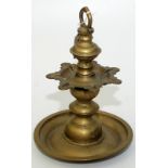 An 18th century Islamic brass, seven spout wick lamp.