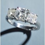 A fine Asscher cut 3 stone diamond ring, the principle stone of approximately 1.