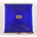 A heavy silver compact, the lid blue enamelled and with naval crown by Gieves & Co Bond Street.
