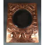 A good Newlyn Copper circular bevelled mirror, the frame with fish,