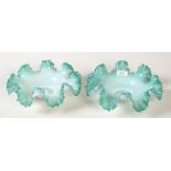 A pair of green Victorian overlay glass bowls, with crenellated rims.