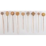 Nine late Victorian pins, the finial of each set a small diamond all in gold or gold mounted.
