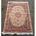 A Kashan design machine made carpet,