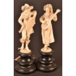A pair of late 19th century or early 20th century Dieppe ivory figures well carved as elderly