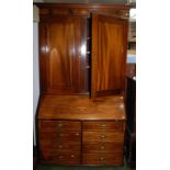 A Georgian style inlaid mahogany bureau bookcase, the upper section with panelled doors,