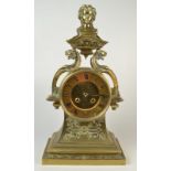 An ornate French brass cased mantle clock, the movement by Raingo, Paris,