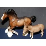 A Beswick donkey and a Beswick heavy horse, maximum height 21.5cm.