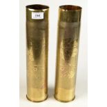 A pair of Remington brass trench art shell case vases with vine engraved decoration, height 35cm.