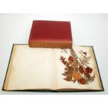 A Victorian album of pressed leaves and hand written poetry,