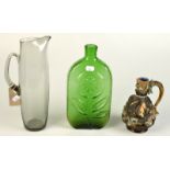 A Whitefriars grey glass tall jug and a moulded art green glass vase.