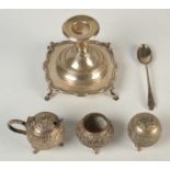 A silver inkstand tray, a silver candlestick, an Indian silver three piece cruet and a silver spoon.