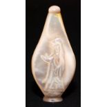 A Chinese mother of pearl scent bottle carved to each side with a bearded figure, height 9.5cm.