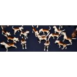 A pack of Beswick hounds, including one with an injured tail and another with a broken ankle,