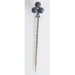 A good Continental gold pin, the clover finial with black and white pearls.
