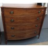 A Regency mahogany bow front chest with ebony and boxwood stringing to the four graduated drawers