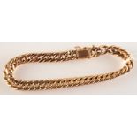 A French 18ct. curb link gold bracelet, 13g.
