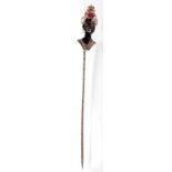 A good pin, the enamelled finial a Blackmoor head with Turkish head dress set a ruby and red coral,