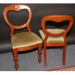 A set of eight Victorian mahogany balloon back dining chairs,