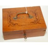 An Indian hardwood stationery box, the lid inlaid W.J.H. beneath a brass handle, width 23cm.